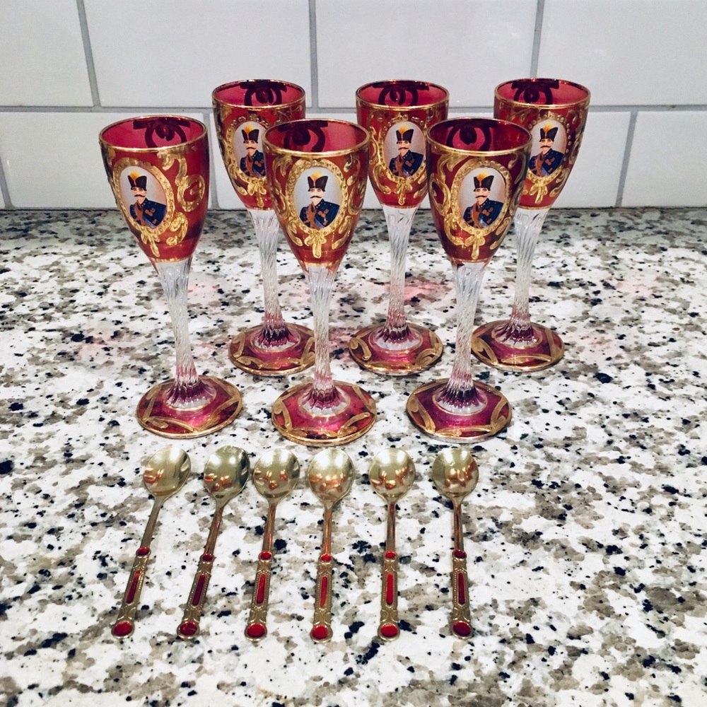 Small maroon and gold glasses with spoons